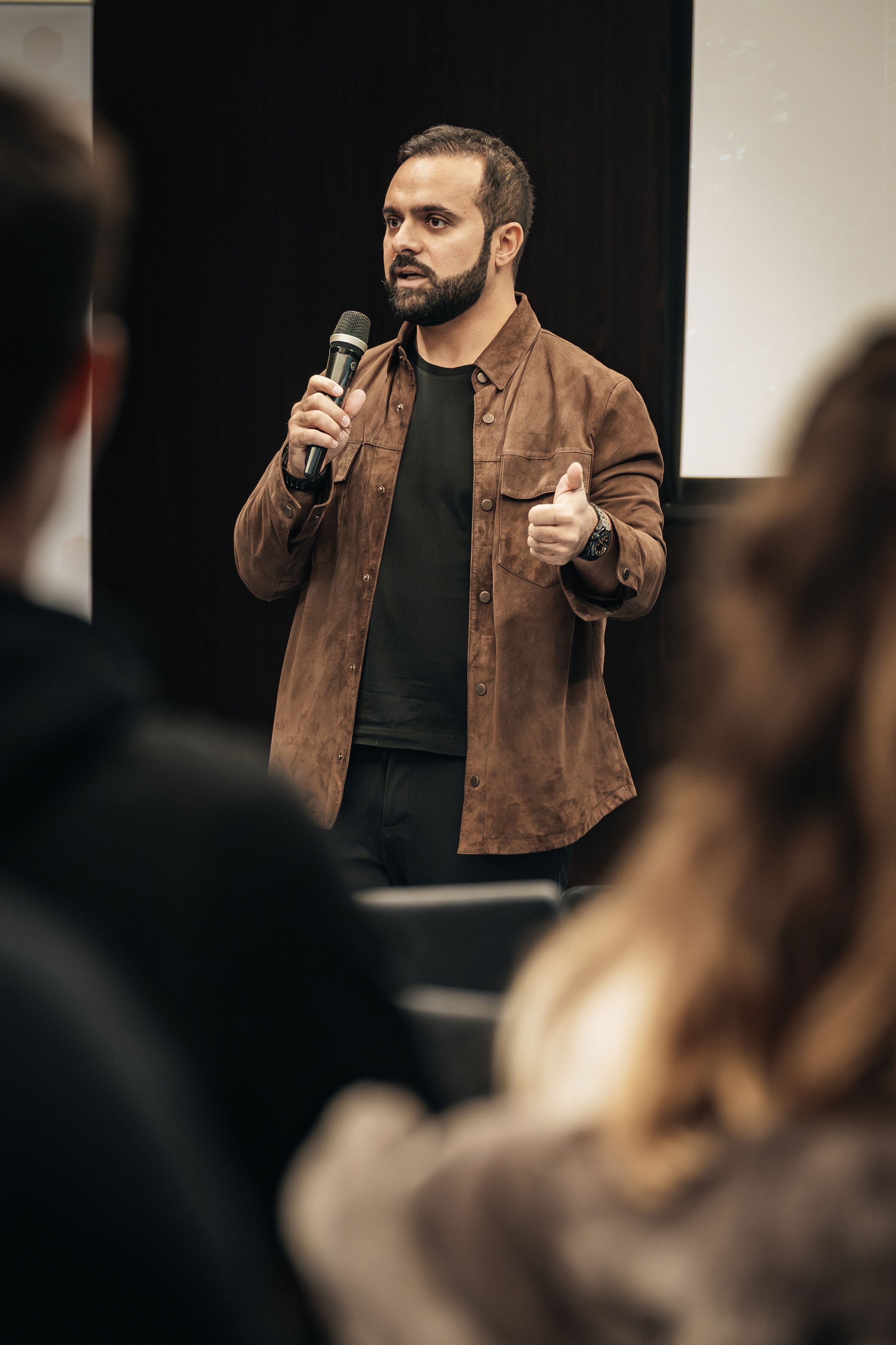 Amr Aboushaban, Founder and CEO of Allegiance Real Estate, addressing an audience